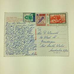 Back of postcards with handwritten text and stamps.