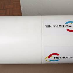 Detail of model for tunnel boring machine. White outer section with black text and logo.