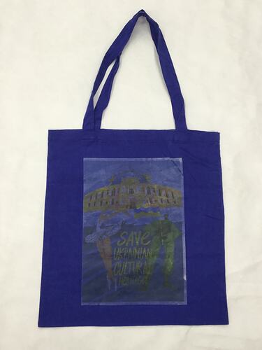 Blue cotton bag with two cotton shoulder straps, with image of a building, ballet dancer and text.