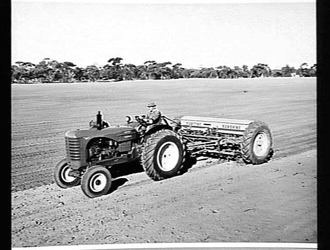 MR. J.W. ANDERSON OF HOPETOUN IN THE VICTORIAN MALLEE, SOWING WHEAT WITH HIS 16-ROW 500 SERIES `SUNTYNE' CULTIVATING DRILL AND SUNSHINE MASSEY HARRIS 745 DIESEL TRACTOR: JUNE 1955