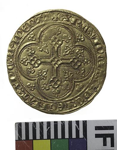 Coin, round, within a circle of beads, quatrefoil with lis on each spandrel containing a floriated cross.