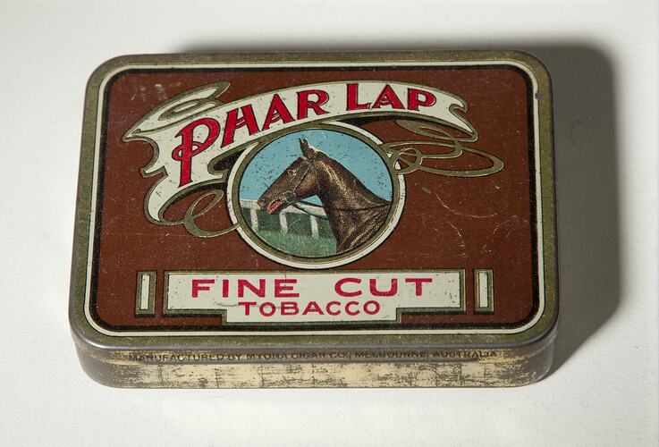 Rectangular maroon tobacco tin with brown racehorse head facing left. Text above and below.
