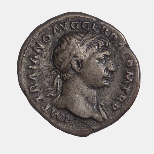Round coin with wreathed  male head facing right. Text around.