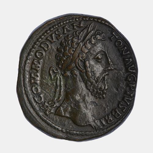 Roughly round coin. Bearded, wreathed man facing right. Text around.