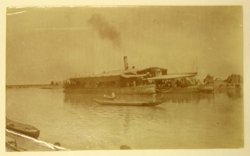 Passenger boat and canoes on the Tigris River.