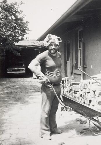 Digital Photograph - Man with Wheelbarrow Renovating House, Fitzroy, 1976