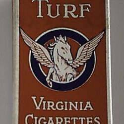 Printed cardboard cigarette box with flip top lid depicting a winged white horse on red background.