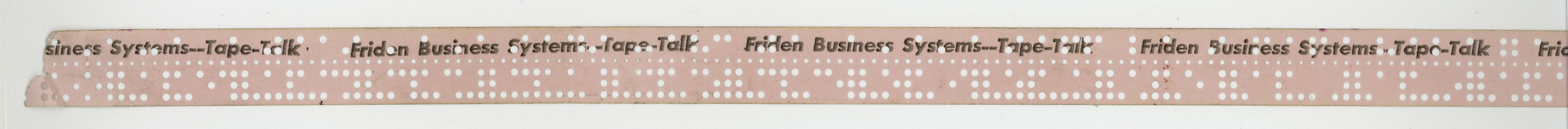 Pink paper tape with punched holes.