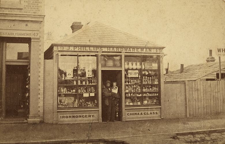Owner & Baby Daughter Outside J Phillips Hardware Man Store, Abbotsford, circa 1865