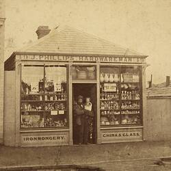 Owner & Baby Daughter Outside J Phillips Hardware Man Store, Abbotsford, circa 1865