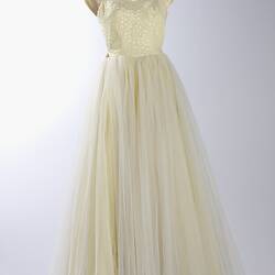 Full length cream evening gown, yellow sequins.