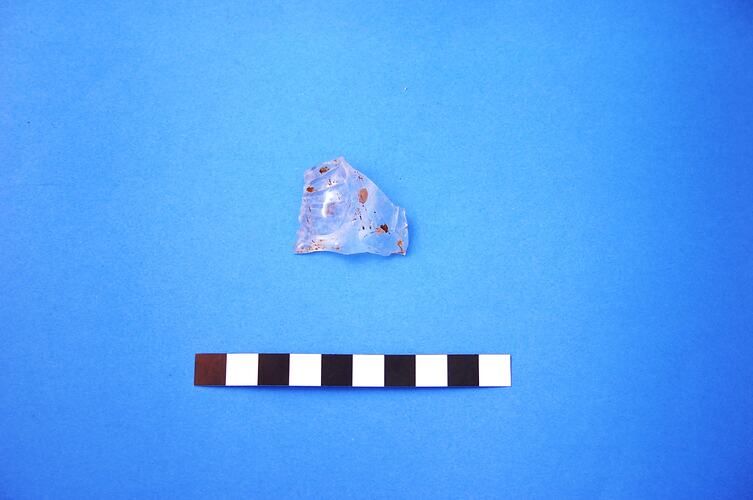 Fragment of speckled glass.
