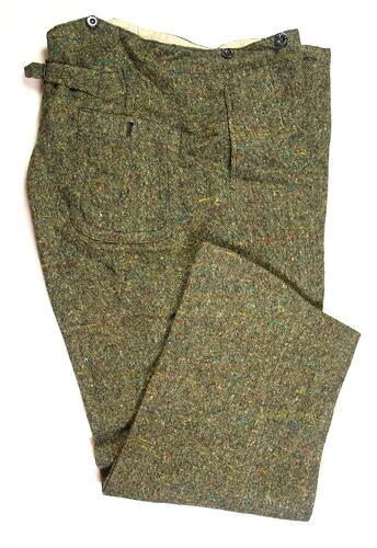 Brown trousers with three buttons at waistline.