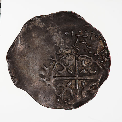 Coin, round, The reverse has a cross moline with a fleur in each angle.