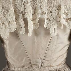 Detail, rear view, faded grey silk wedding dress.