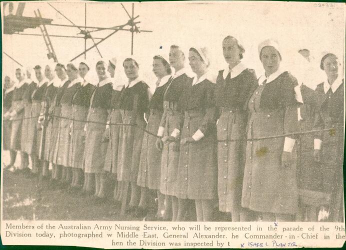Women in nurses uniform standing in row.