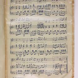 Page with printed sheet music.