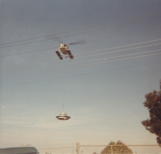 Helicopter flying with chimney lid.