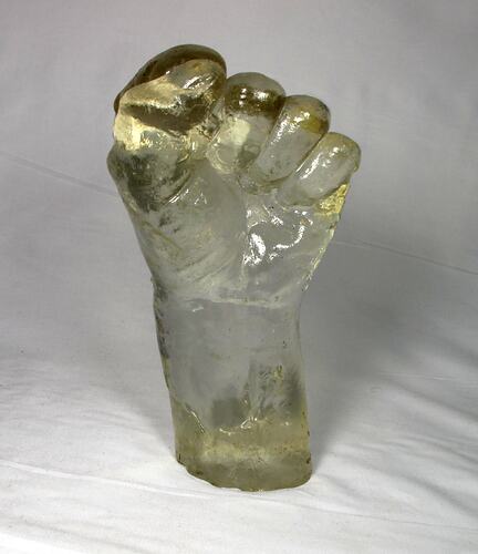 Glass mould of man's clenched fist.
