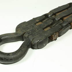 Metal chain with square links. Detail loop at end.