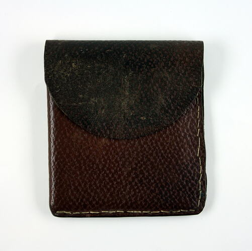 Front of brown leather wallet.