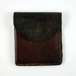 Front of brown leather wallet.