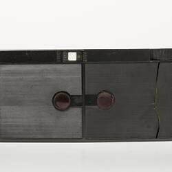 Black rectangular Bakelite camera. Rear view.