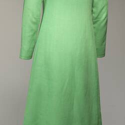 Back of lime green linen long-sleeved maxi coat.