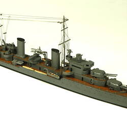 Naval ship with two masts, three quarter view.