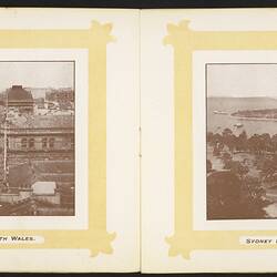 Open booklet, off-white pages. Yellow framed city view on left page and bayview on right page.