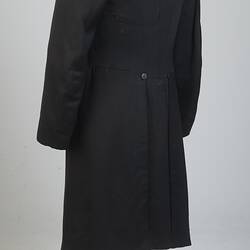 Gentleman's black cotton frock coat, back view.