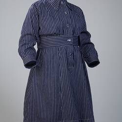 Navy blue cotton dress, with fine white stripes.