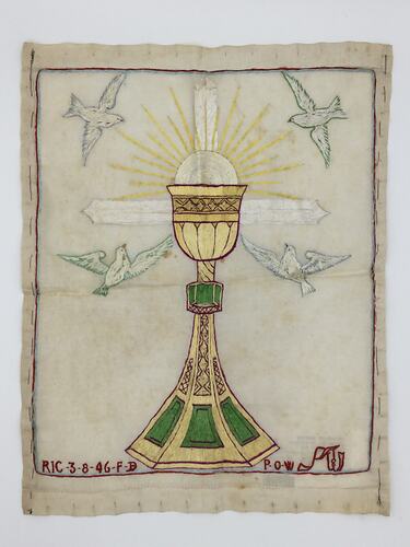 Hand-embroidered white cloth with a gold, red and green chalice, birds in white thread and inscription in red.