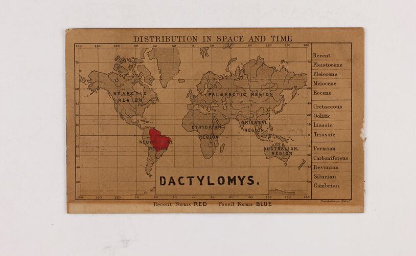Retangular brown card with black and red text and map