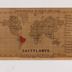 Retangular brown card with black and red text and map