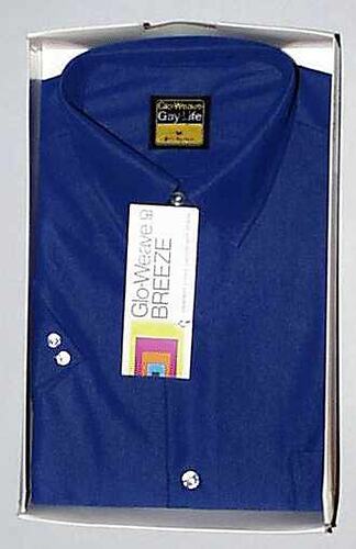 Man's folded blue collar button down shirt in a box
