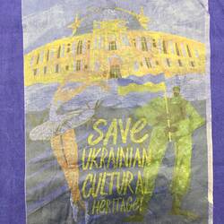 Detail of blue cotton bag with image of a building, ballet dancer and text.