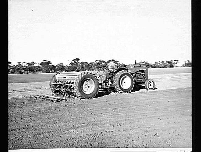 MR. J.W. ANDERSON OF HOPETOUN IN THE VICTORIAN MALLEE, SOWING WHEAT WITH HIS 16-ROW 500 SERIES `SUNTYNE' CULTIVATING DRILL AND SUNSHINE MASSEY HARRIS 745 DIESEL TRACTOR: JUNE 1955