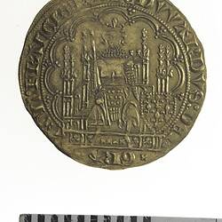 Coin, round, within a tressure of arches, the King wearing a crown, holds a sword and shield.