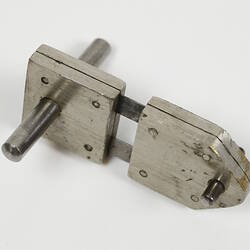 Metal hinge piece.
