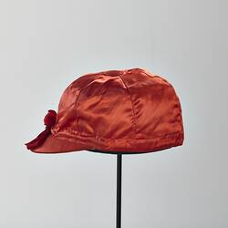 Red silk jockey cap.