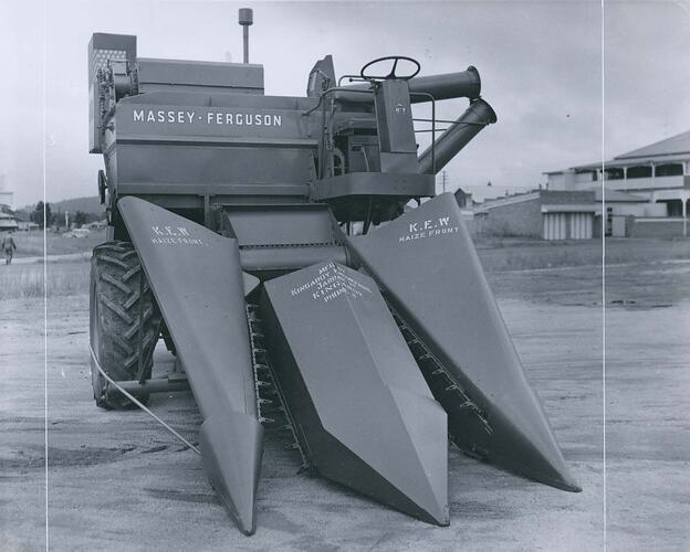 A harvester fitted with a maize front.