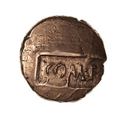 Coin, round, on sunken tablet, with text COM.F. (translation, son of Commius).