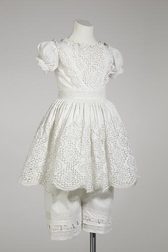 Small white dress and bloomers with lace.