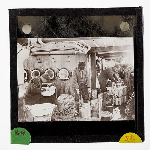 Lantern Slide - Scientists Inspecting a Netted Haul on the Discovery, BANZARE Voyage 1, Antarctica, 1929-1930