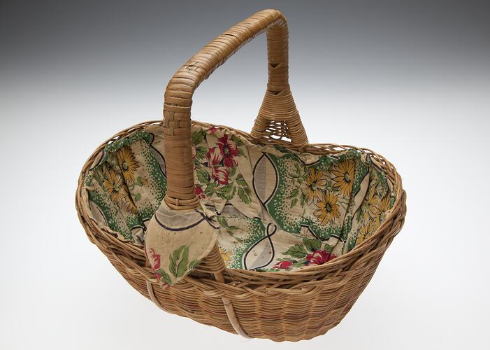Oval shaped basket lined with flower print cotton.