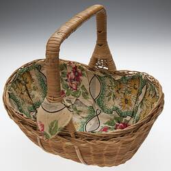 Oval shaped basket lined with flower print cotton.
