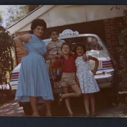 Digital Photograph - Nazha Eid With Her Children In Front of Home With Taxi, Melbourne, 1982