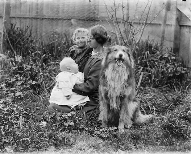 Women and Children in Garden with Dog, circa 1910s