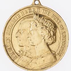 Medal with conjoined left facing profile of Prince Phillip and Queen Elizabeth. Text around.